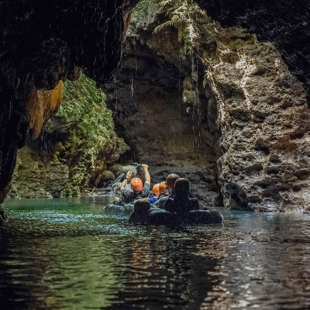 Float downstream on a tube, passing caves and cliffs.